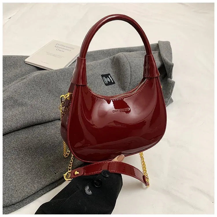1pc Solid Color Glossy Patent PU Leather Shoulder Bag, Women's Fashion Underarm Crossbody Crescent Bag With Ancora Red Letter, Top Handle, Metal Zipper Closure, Metal Chain Shoulder Strap - Rozzlux